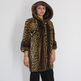 Ocelot coat with hood and mink trimming