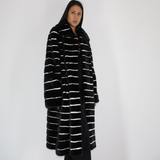 Black with stripes of white shaved mink coat